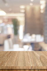 Table and blur restaurant background, Wooden counter cafe over blur bokeh light background, Shelf for food and retail shop, store food and product display backdrop, banner, mockup, vertical