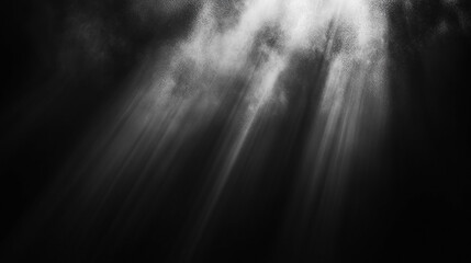 Obraz premium Dramatic beams of light shining through dark clouds.