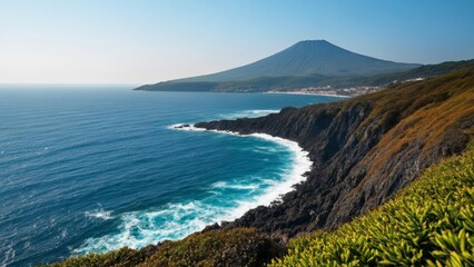 Obraz premium Majestic coastal view with a towering volcano in the distance