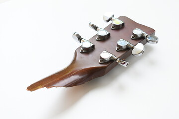 part of broken wood acoustic guitar isolated on white background