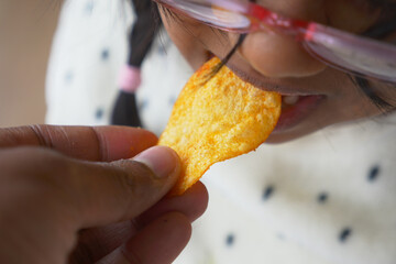 Sharing Crispy Chips Together A Joyful and Fun Moment Between Family and Kids at Home