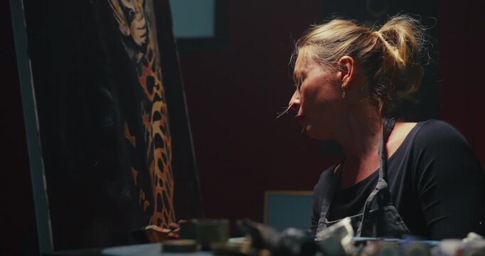 Woman Painting Tiger on Easel