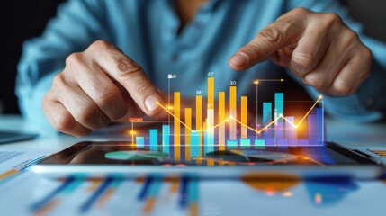A close-up of a businessman examines sales data and financial reports on a tablet. Financial report planning and strategy for business, finance, and investment concepts