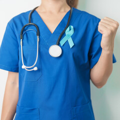 Blue November Prostate Cancer Awareness month, Doctor with Blue Ribbon in hospital for support people life and illness. Healthcare, International men, Father, Diabetes and World cancer day