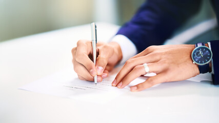 Business, hands and writing on paperwork in office for legal contract, compliance report and...