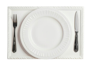 Elegant white plate and silver cutlery on a stylish table setting, perfect for gourmet dining or food presentation.