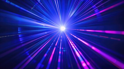 Obraz premium Bright laser light beams in blue and violet on a dark backdrop