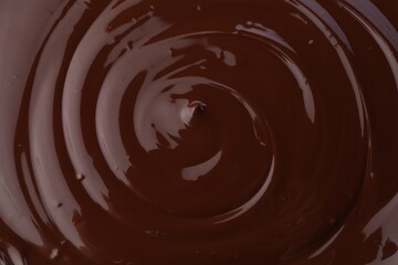 Tasty melted chocolate as background, closeup view