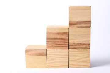 Many blank wooden cubes on white background