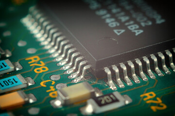 Macro close-up of a microcircuit: detailed tracks and components, shiny metal contacts, complex...