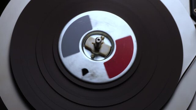 Audio Tape Spinning on Reel to Reel Recorder Player, Close Up