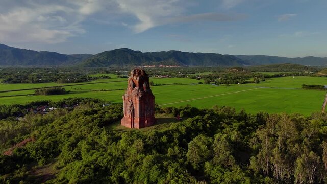Phu Loc Champa Temple, aerial fly fly past revealing lush green paddy fields. Quy Nanh, Vietnam.