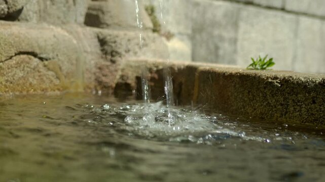 Water pouring down in a fountain.