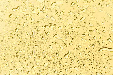 Water drops on yellow background, yellow water drops pattern background