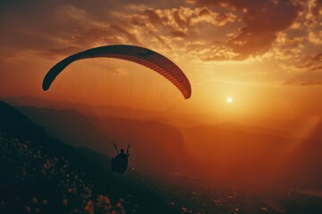Paraglider in Mountain Sunset