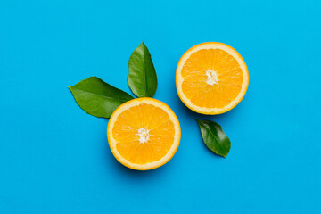 fresh Fruit orange slices on colored background. Top view. Copy Space. creative summer concept. Half of citrus in minimal flat lay with copy space