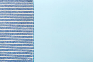 top view with blue kitchen napkin isolated on table background. Folded cloth for mockup with copy space, Flat lay. Minimal style