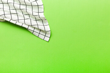 top view with white empty kitchen napkin isolated on table background. Folded cloth for mockup with...