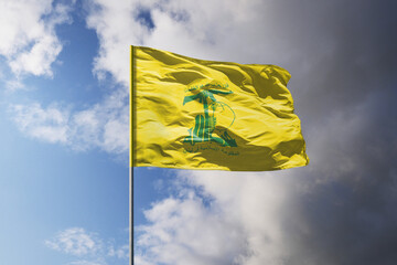 Flags of Hezbollah above dark sky