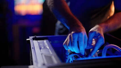 Person assembling gaming computer with graphic card GPU