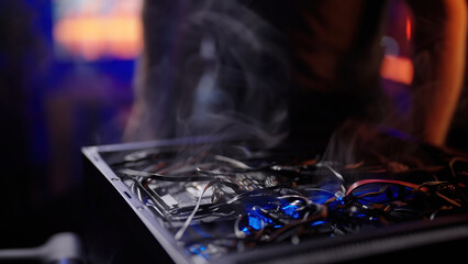 Computer backside cable management mess with smoke rising