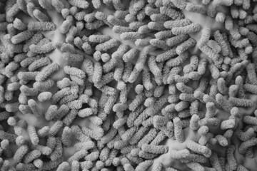 Processed image of fluffy gray doormat from bathroom in grey color