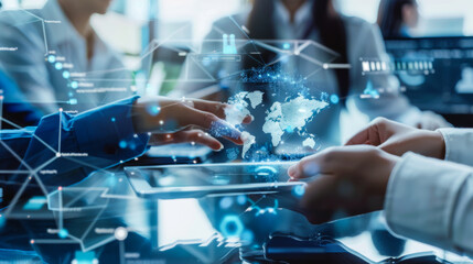 Office workers in business clothes use a new technology tablet with a global interface in a bright modern office. Professional business people reviewing work on a digital screen. Technology concept.