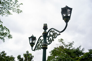 Typical Street Lamp in Yogyakarta and vintage lamp. Retro style green street lamp post on...