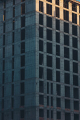 Fototapeta premium building construction. Industrial background. High-rise multi-storey buildings under construction.