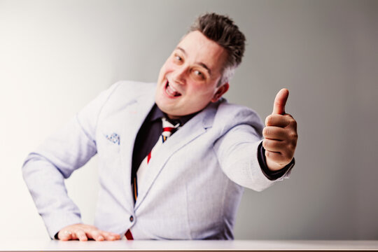 Sly salesman making fake promise with thumbs up gesture