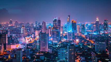 Fototapeta premium A bustling city skyline at night, filled with illuminated skyscrapers and vibrant lights