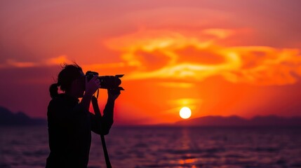 Obraz premium Photographer rubbing hands together with anticipation before capturing a stunning sunset shot