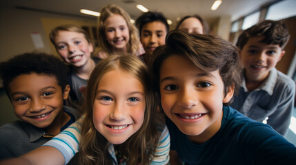 Class selfie in an elementary school. Kids taking a picture together in a co-ed school, photography.
