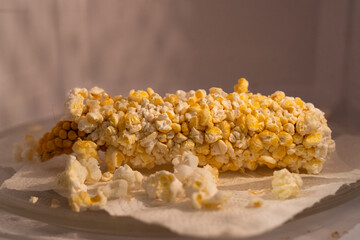 A cob of corn in a microwave turned into popcorn with the help of microwave rays