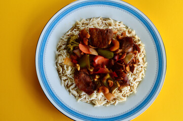 Delicious Malaysian style duck with vegetables and steamed rice.