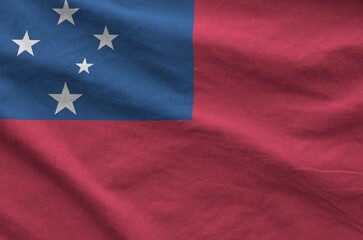 Samoa flag depicted on folded wavy fabric of old cloth close up