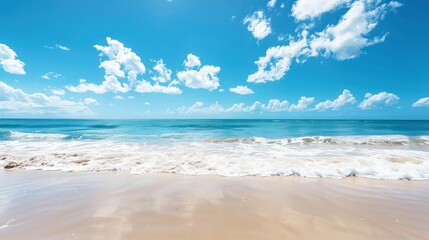 Serene beach scene with clear blue skies and gentle waves