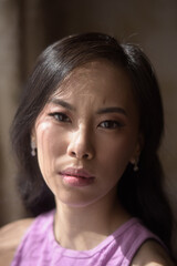 Candid portrait of young asian woman