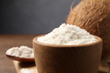 Coconut flour in bowl on table, closeup