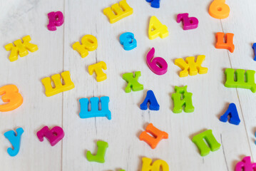 Cyrillic letters on white wooden background 