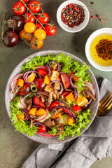 Easy vegetarian salad of fresh cucumber, mushrooms, tomato, sweet pepper, radish and onion in bowl . Healthy food. Top view