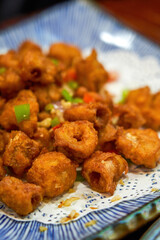 A plate of delicious Chinese food, deep fried crispy pig intestines