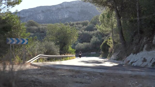 Motorcycle riding on a mountain road