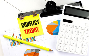 CONFLICT THEORY text on yellow sticky with calculator, pencil and chart