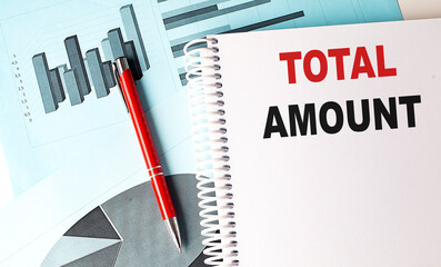 TOTAL AMOUNT text on notebook on chart background