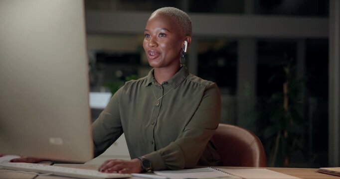 Black woman, talking and typing with computer, office and night as multilingual support agent. Female person, tech and earphones for international call center, working or conversation as professional