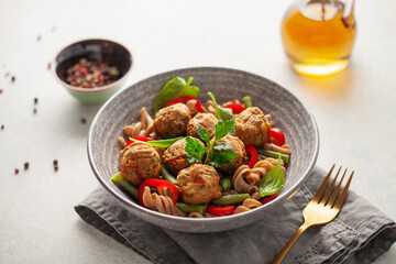 Vegan food. Vegetable meatballs and buckwheat pasta with vegetables in a bowl on the table.