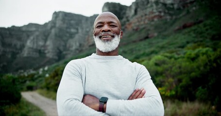 Black man, face and crossed arms outdoor for fitness, retirement and hiking in morning with smart watch. Mature person, portrait and confidence in nature by mountains for health, workout and exercise