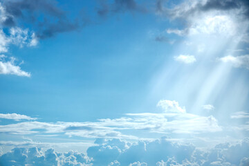 a view of the undercast with clouds through which the rays of the sun are streaming