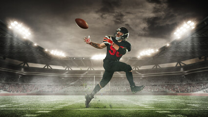 Dynamic image of man, American football player in motion, hitting ball in run, during match, on...